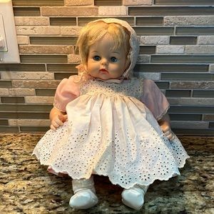 Madam Alexander blond blue-eyed sitting doll